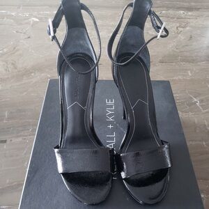 Brand new Kendall and Kylie patent black sandals size 7. Comfortable heel.